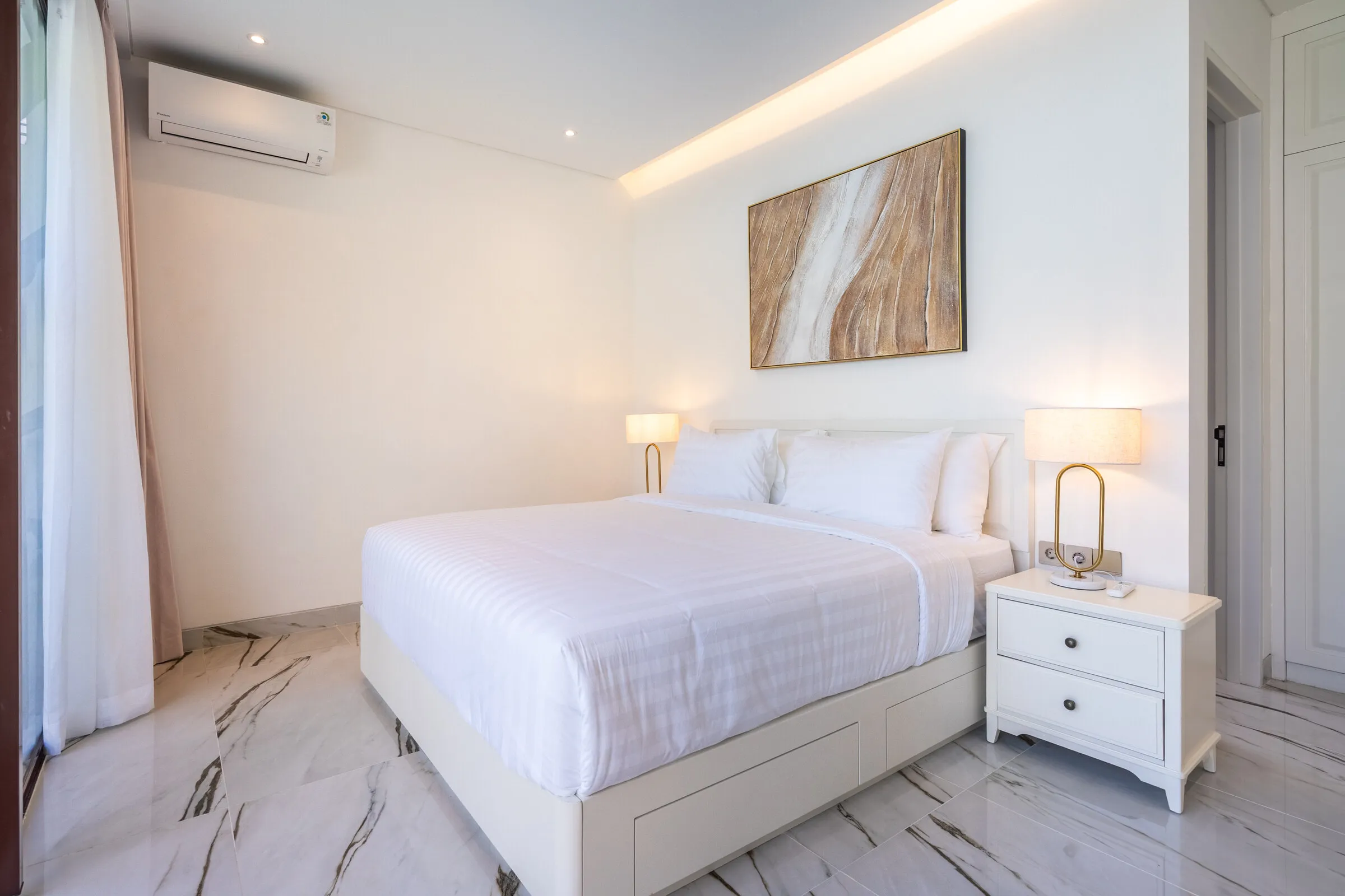 Second bedroom with king bed and bedside lamps
