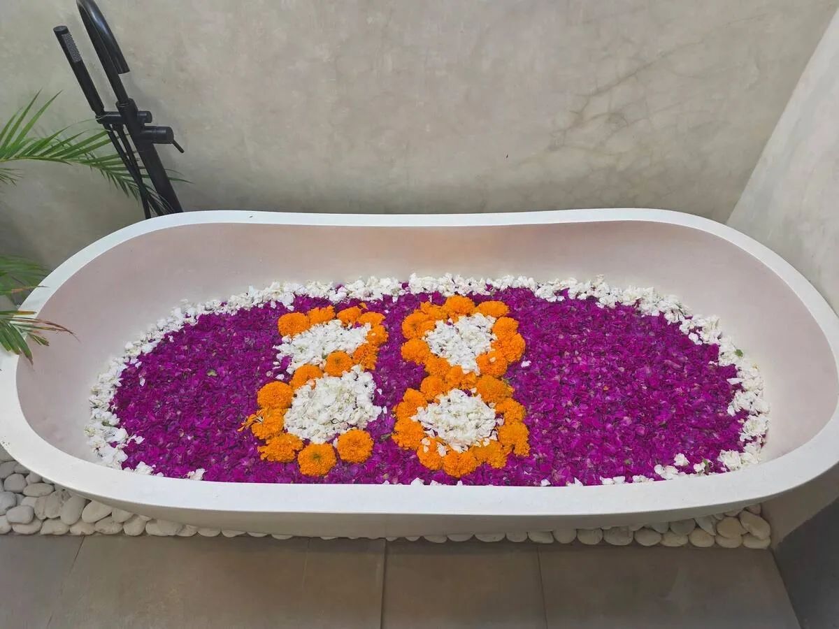 Bathtub filled with flower petals